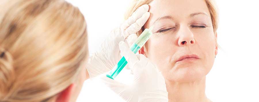 A woman getting a Botox injection