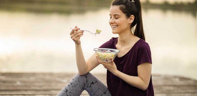 A woman eating a salad